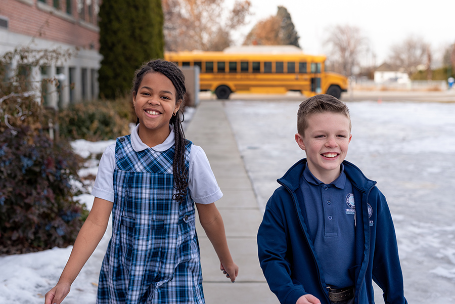 Boy And Girl Outside School.